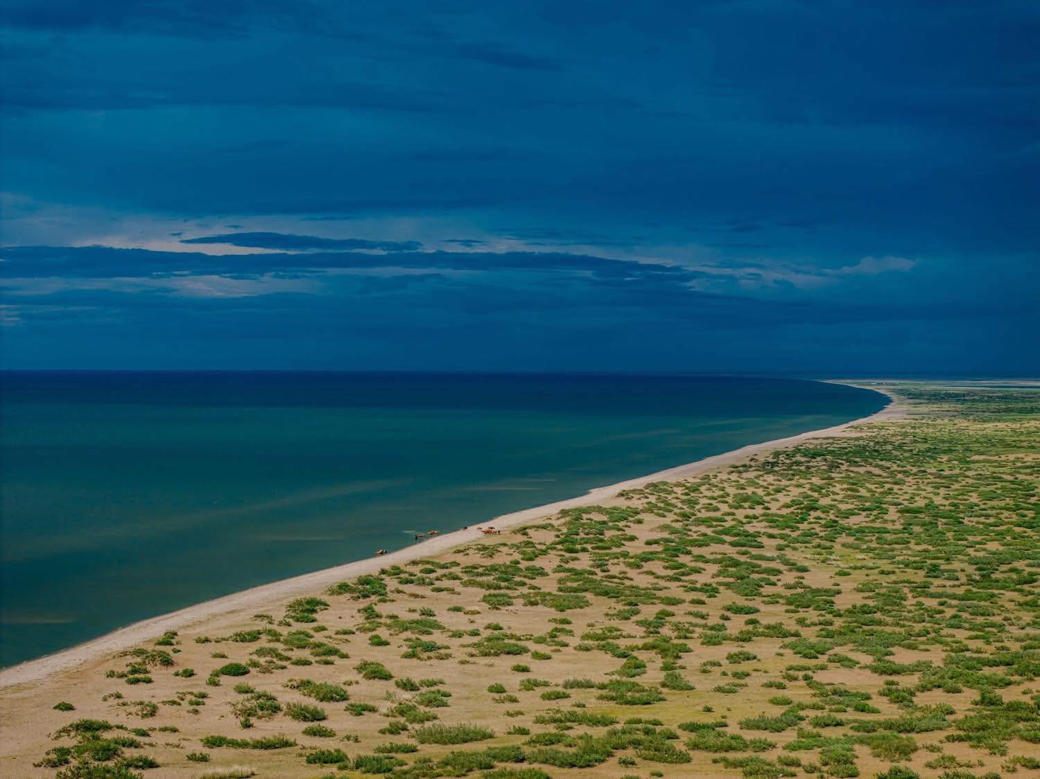 Buir Lake's broad blue water and steppe shoreline in Dornod Province.
