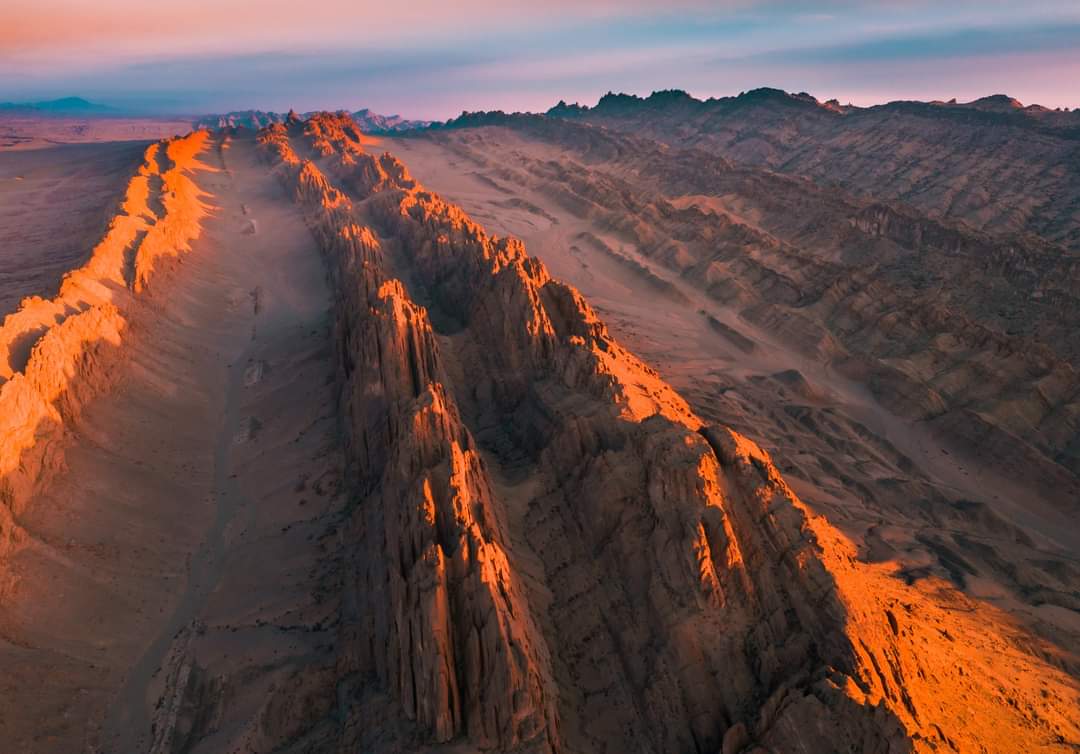 Hanan Khets desert ridge in Ömnögovi lit by low evening sun.